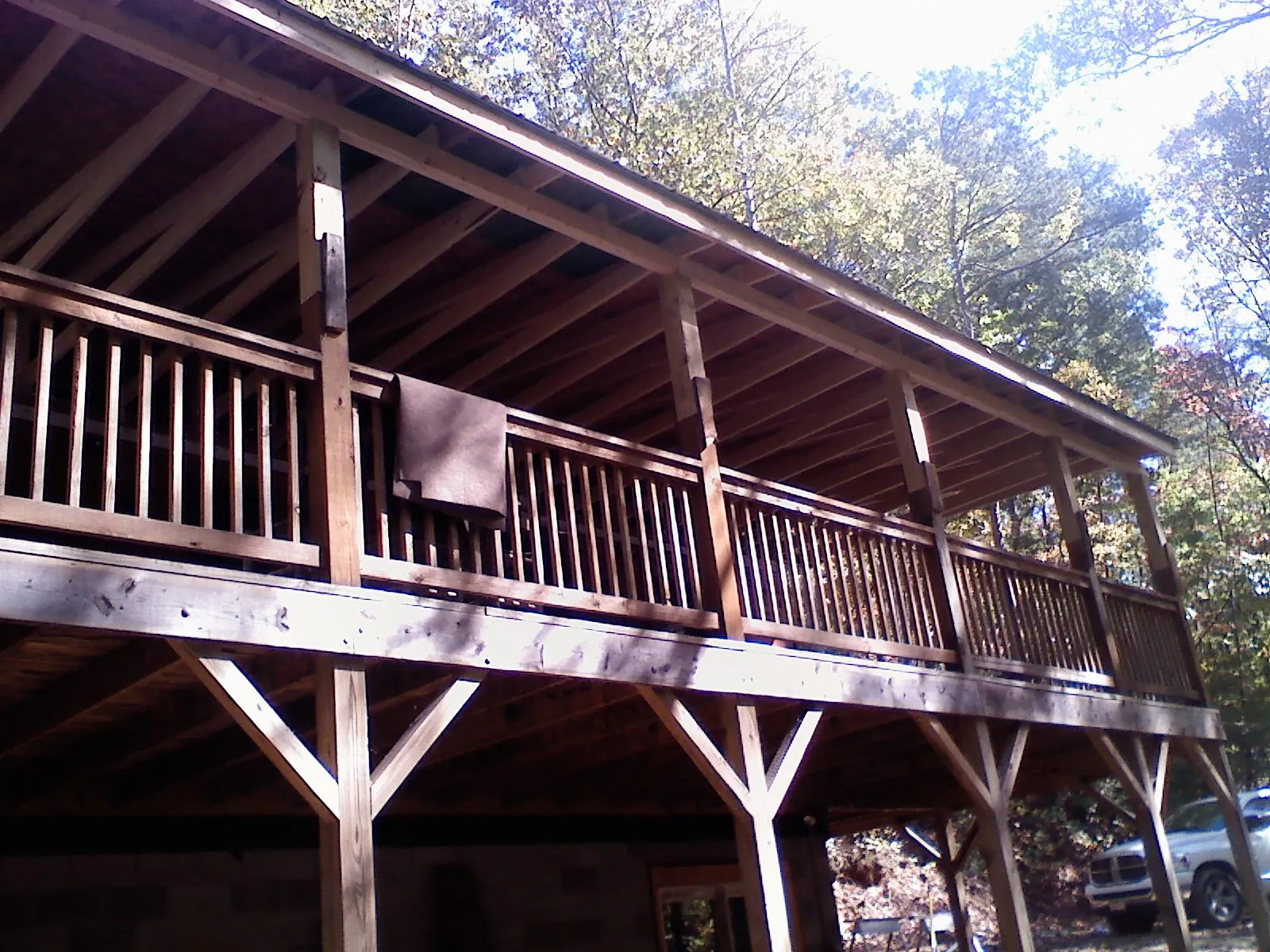 Timber framing under a new elevated porch and deck — Roof Leak Repair in Comstock by Roofing Brothers
